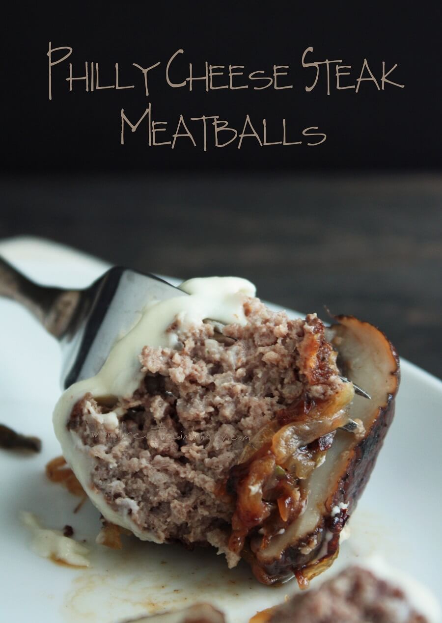 Cross section of a keto cheesesteak meatball on a fork