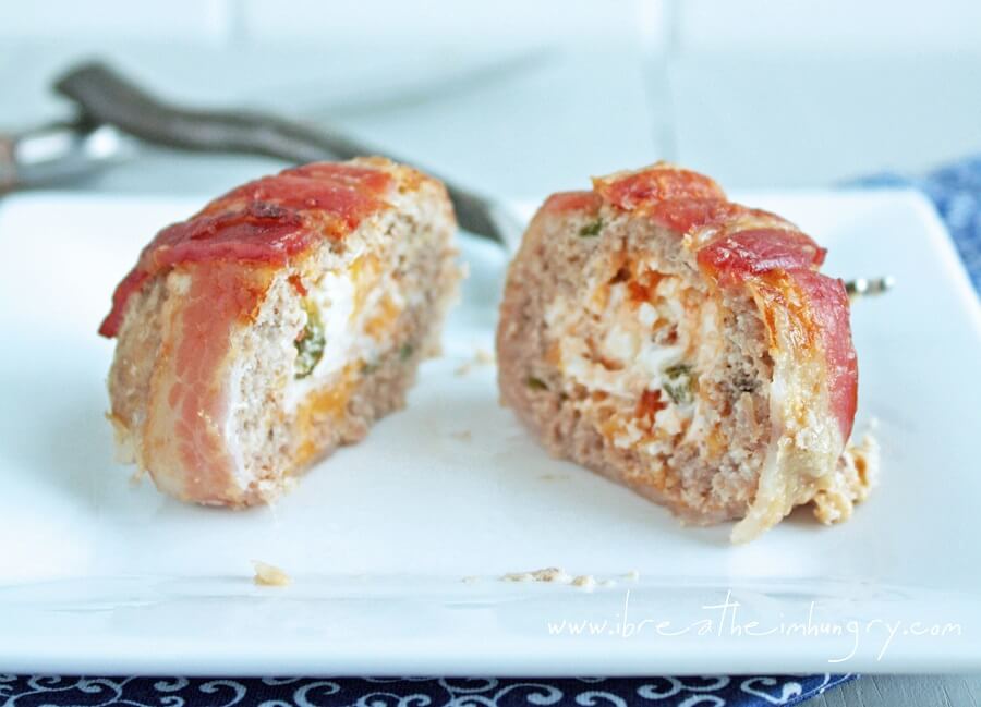 jalapeno popper meatball cut in half to show the cream cheese center