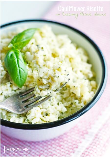 This versatile low carb side dish recipe perfectly mimics a classic risotto but is made with cauliflower in a cheesy pesto sauce. Keto and Atkins friendly.