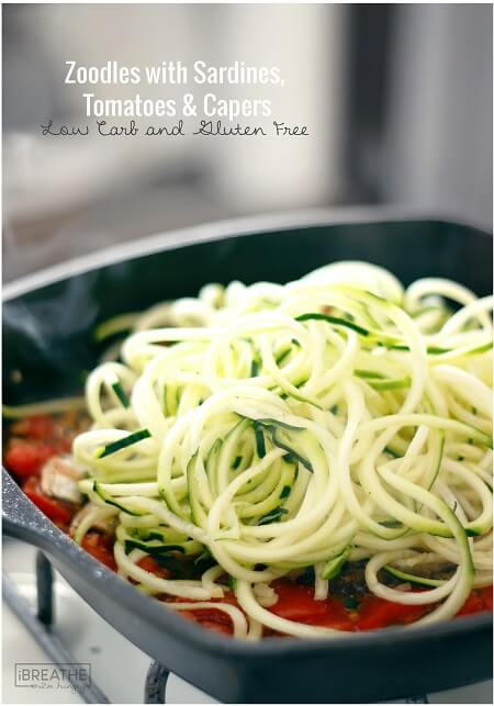 This low carb zucchini recipe contains super healthy sardines, garlic, tomatoes, capers and fresh herbs. Easy and delicious, it's also Paleo and Whole 30 approved!!