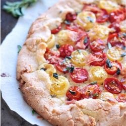 This rustic tomato tart boasts creamy ricotta, garlic and herb oil and crispy proscuitto. Low Carb and Gluten Free.