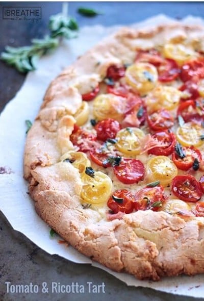 This rustic tomato tart boasts creamy ricotta, garlic and herb oil and crispy proscuitto. Low Carb and Gluten Free.