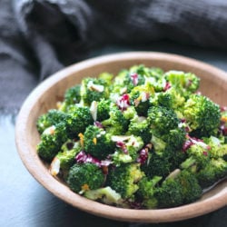 Keto Broccoli Salad in a wooden bowl on a slate background