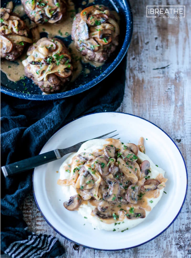 Baked in the oven, these easy low carb Salisbury Steaks are tender & delicious served with mushroom gravy. 