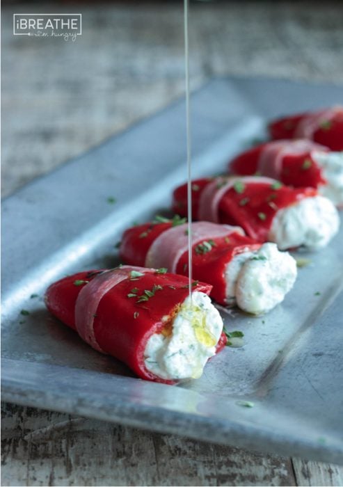 There's no cooking required for these easy low carb herbed goat cheese stuffed piquillo peppers! A great low carb appetizer or addition to an antipasto platter!
