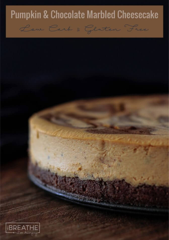 This Pumpkin Chocolate Marbled Cheesecake boasts a rich and creamy pumpkin filling with ribbons of chocolate cheesecake running through it and a chocolate cookie crust. Keto and Atkins friendly!