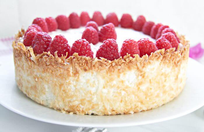 A gorgeous keto raspberry cheesecake recipe with a hint of lemon and a coconut macaroon crust!