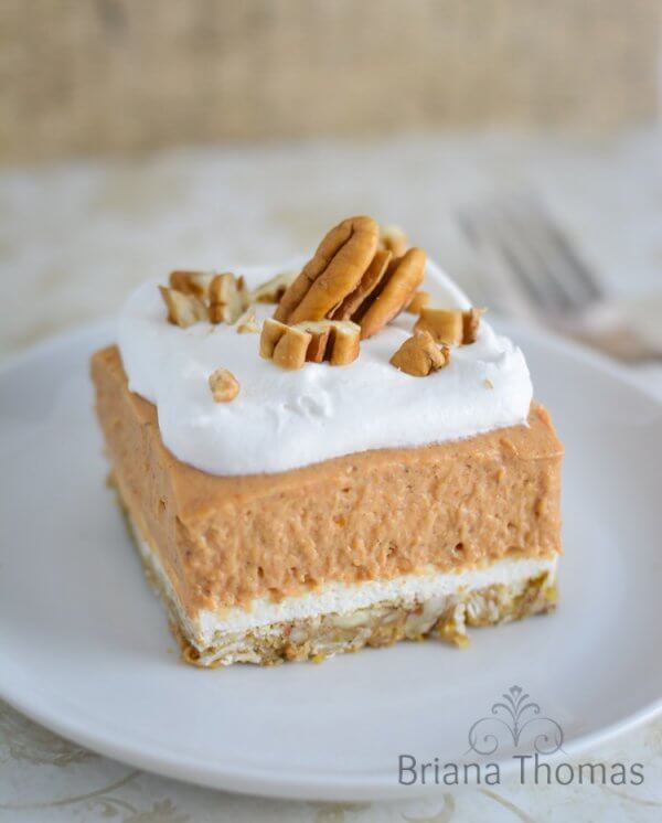 Keto Pumpkin delight with whipped cream and pecans on top - best keto pumpkin recipes