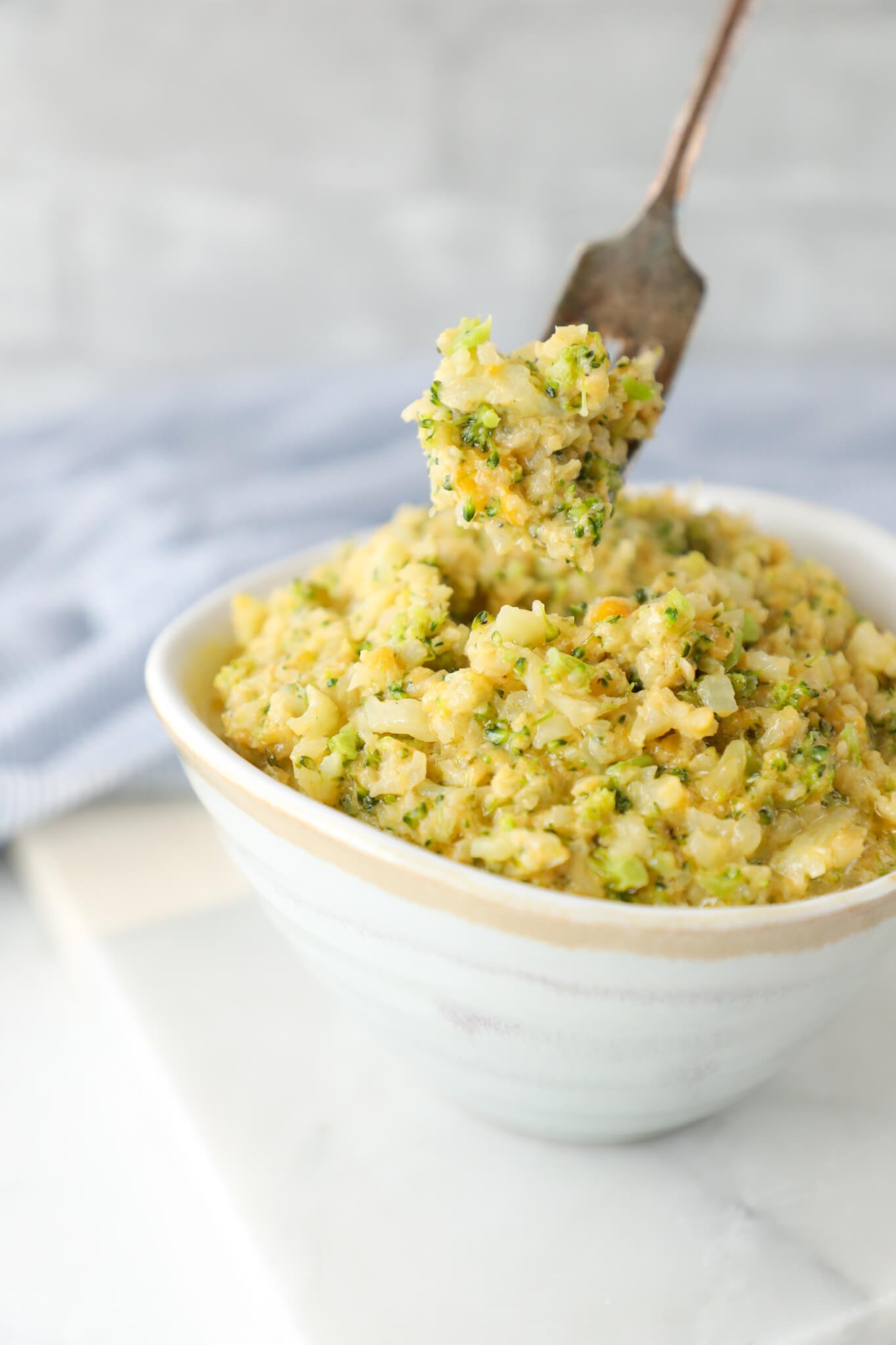 Forkful of Keto Cheesy Broccoli & Cauliflower Rice
