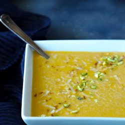 Keto curried squash soup in a square white bowl