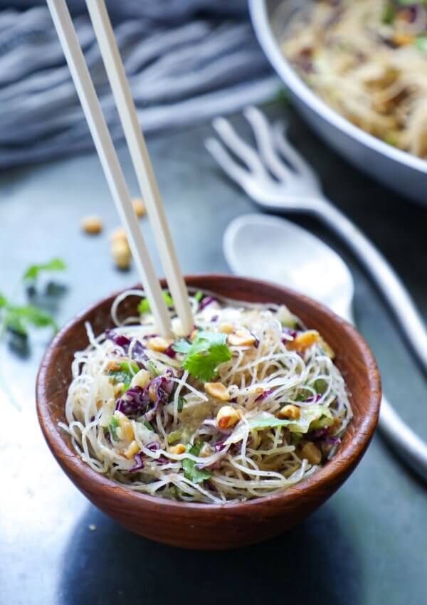 Keto Asian Noodle Salad with Peanut Sauce in a wooden bowl with chopsticks