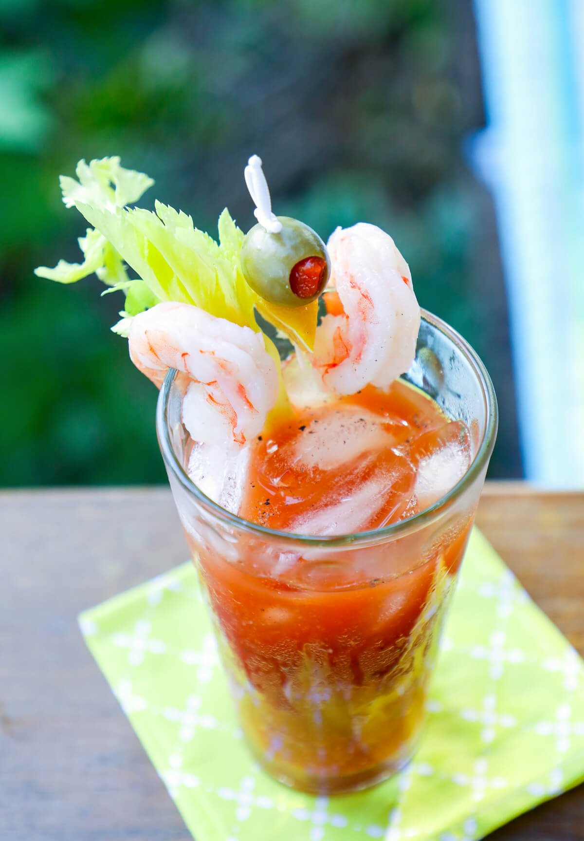 Bloody Mary top view with shrimp and olive garnish