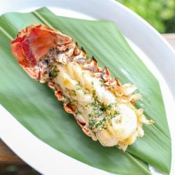 Keto Grilled Lobster Tails with Creole Butter on banana leaf
