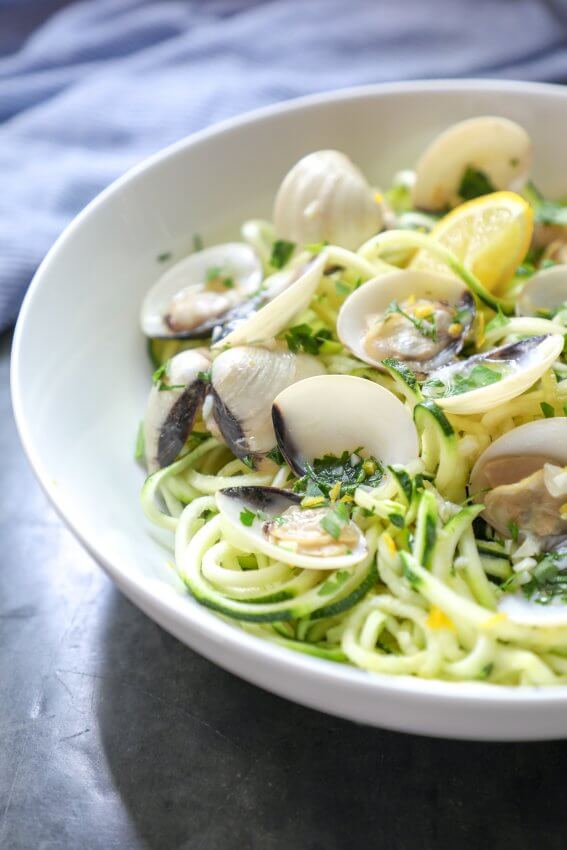 Keto Zoodles with White Clam Sauce on concrete background