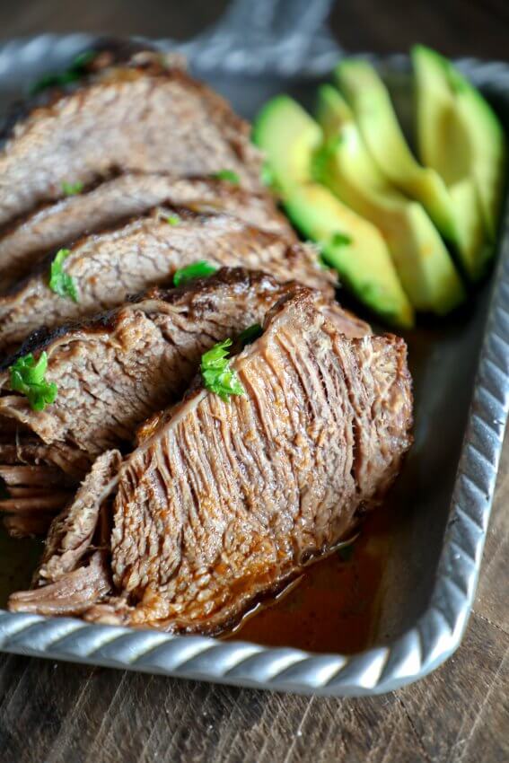 Keto Beef Brisket in the Instant Pot with sliced avocado