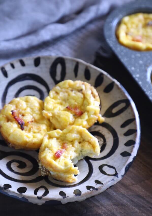 Keto Bacon & Egg Onion Cups with a bite taken out of one
