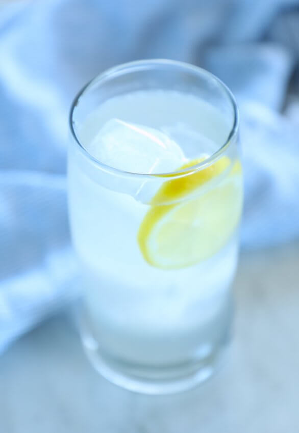 keto ginger lemon detox drink in a clear glass with ice