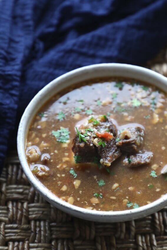 Instant Pot Keto Beef Barley Soup with a blue napkin