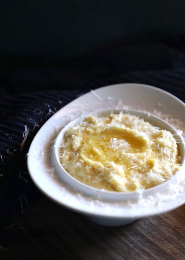 Cheesy Keto Polenta front view garnished with grated parmesan cheese