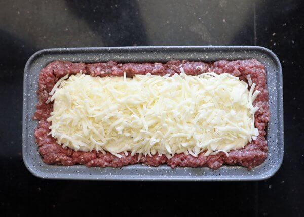 Grated mozzarella cheese on top - Keto Lasagna Meatloaf step 4