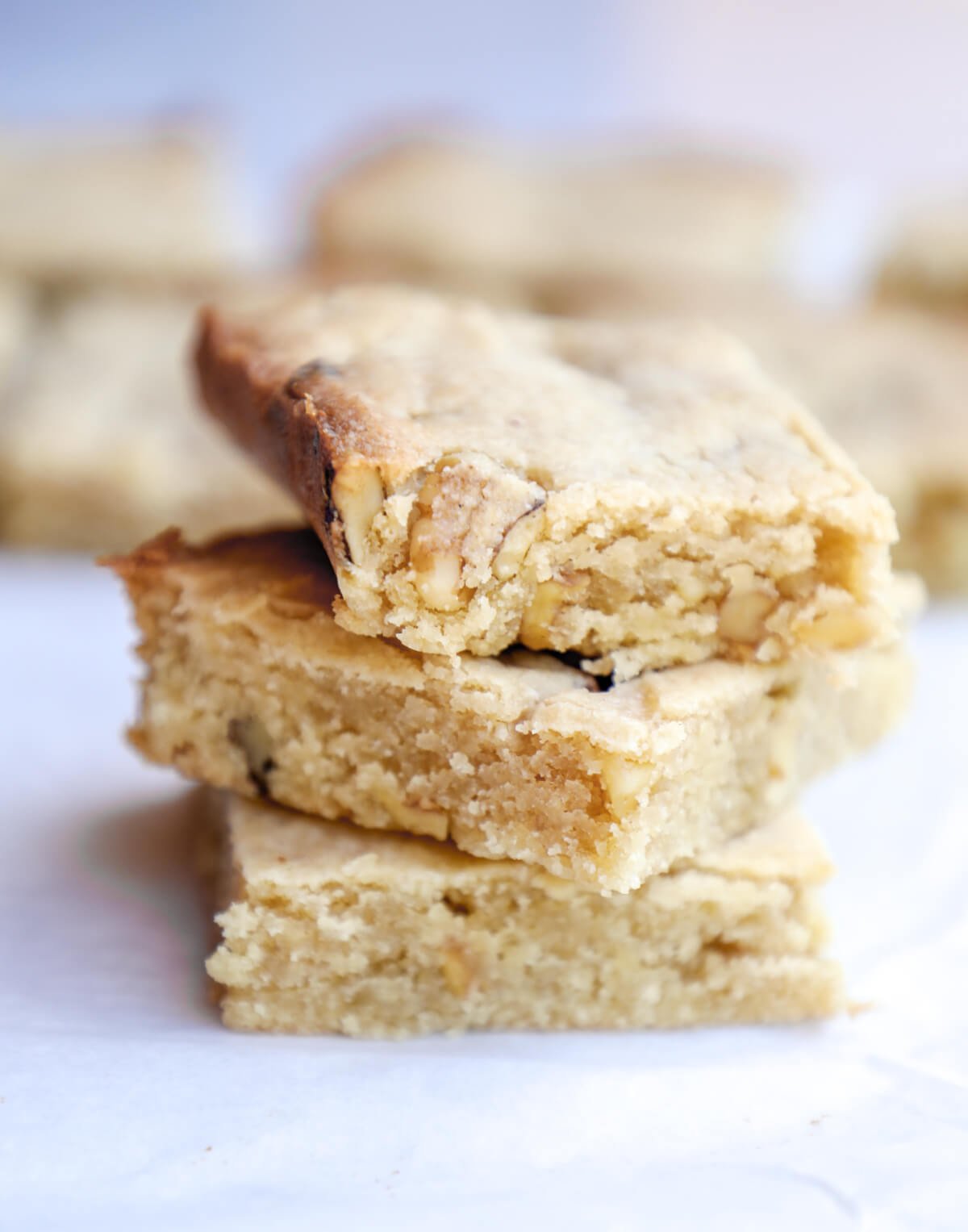 3 keto butter rum blondies stacked on top of each other to show texture