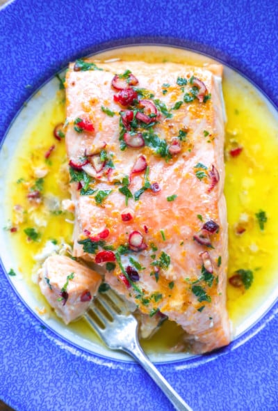 Keto Salmon with Cranberry Orange Butter on a blue and white plate