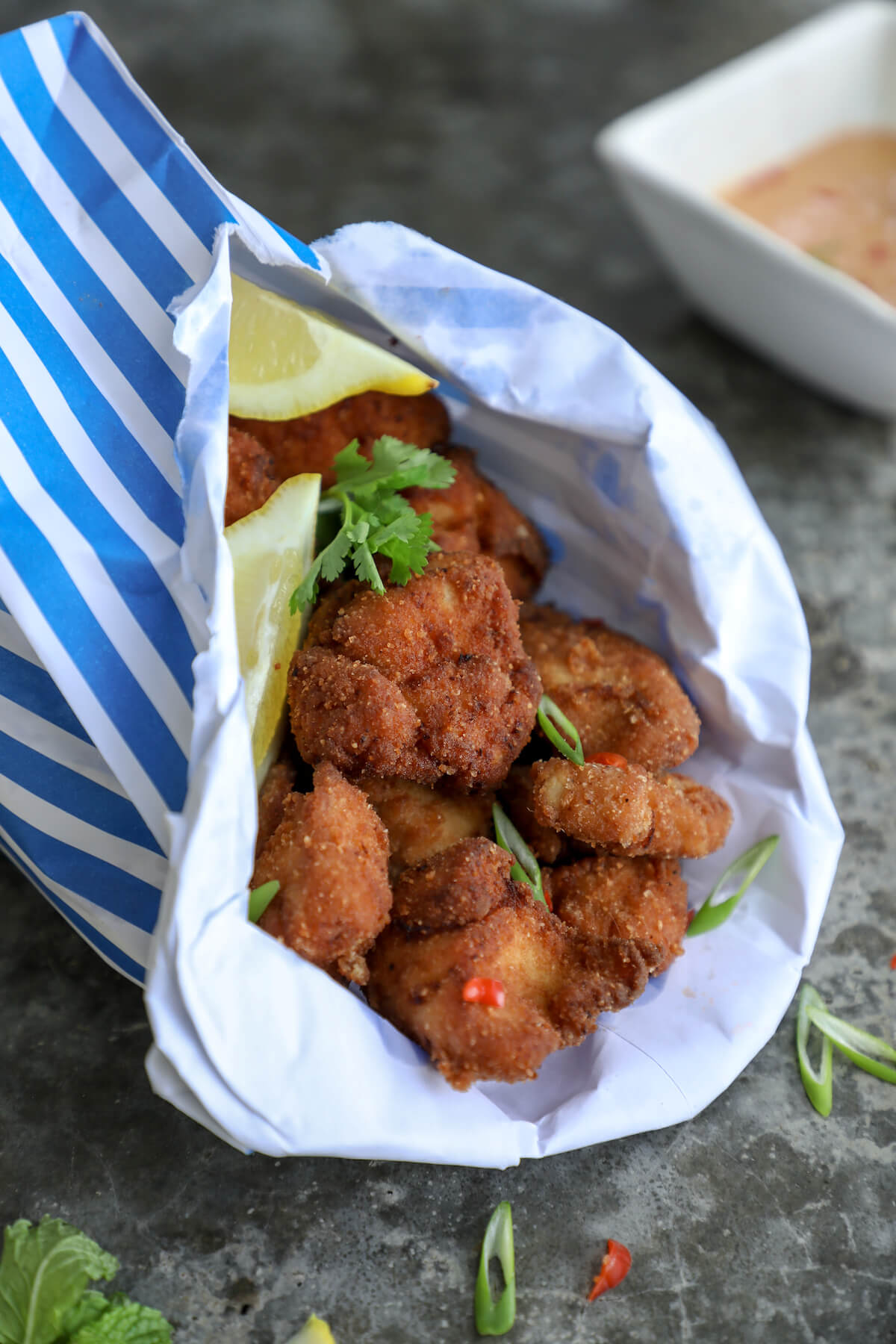 Keto Chicken Karaage in a blue and white striped paper bag