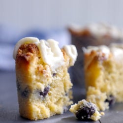 Keto Blueberry Muffins cross section with dripping lemon glaze